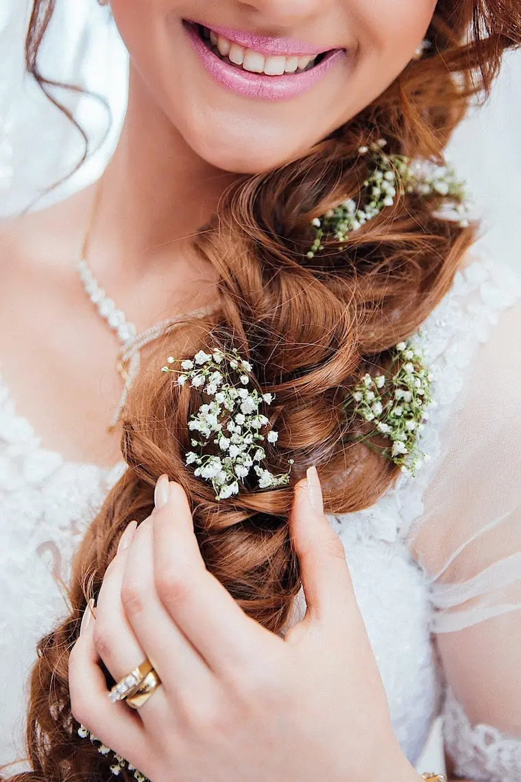 babys breath in braid wedding hairstyle