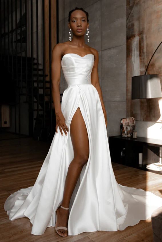 bride wearing empire dress with leg slit