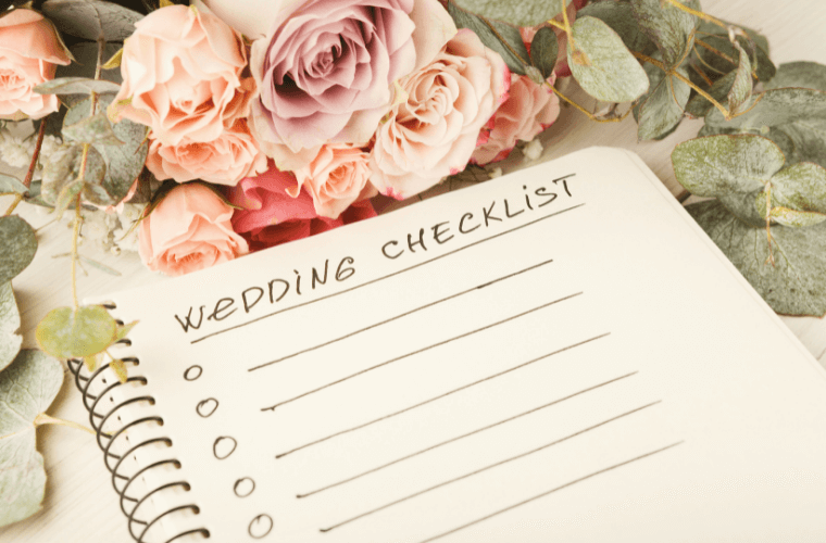 wedding checklist in notebook with flowers