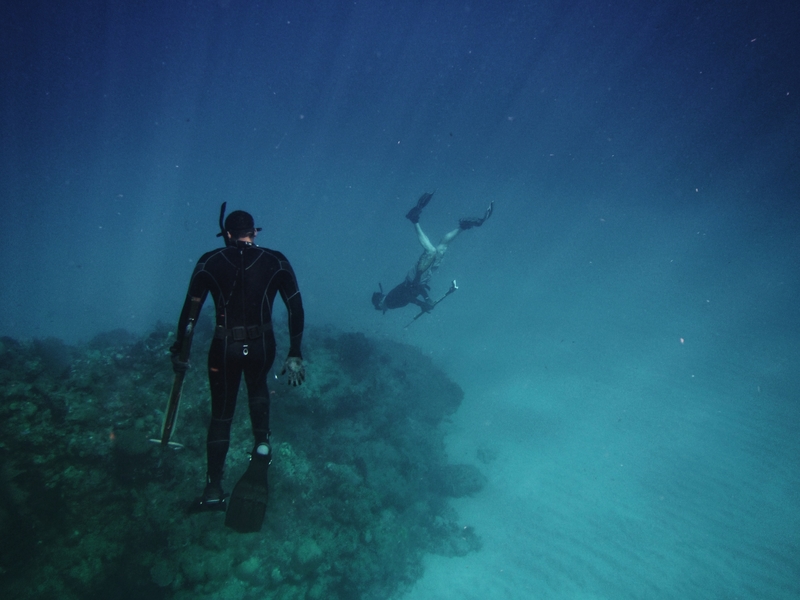 couple snorkelling underwater 