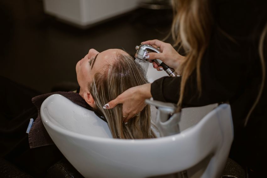 woman getting her hair washed