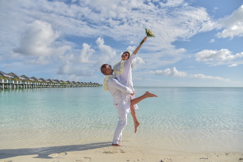 couple on beach destination wedding