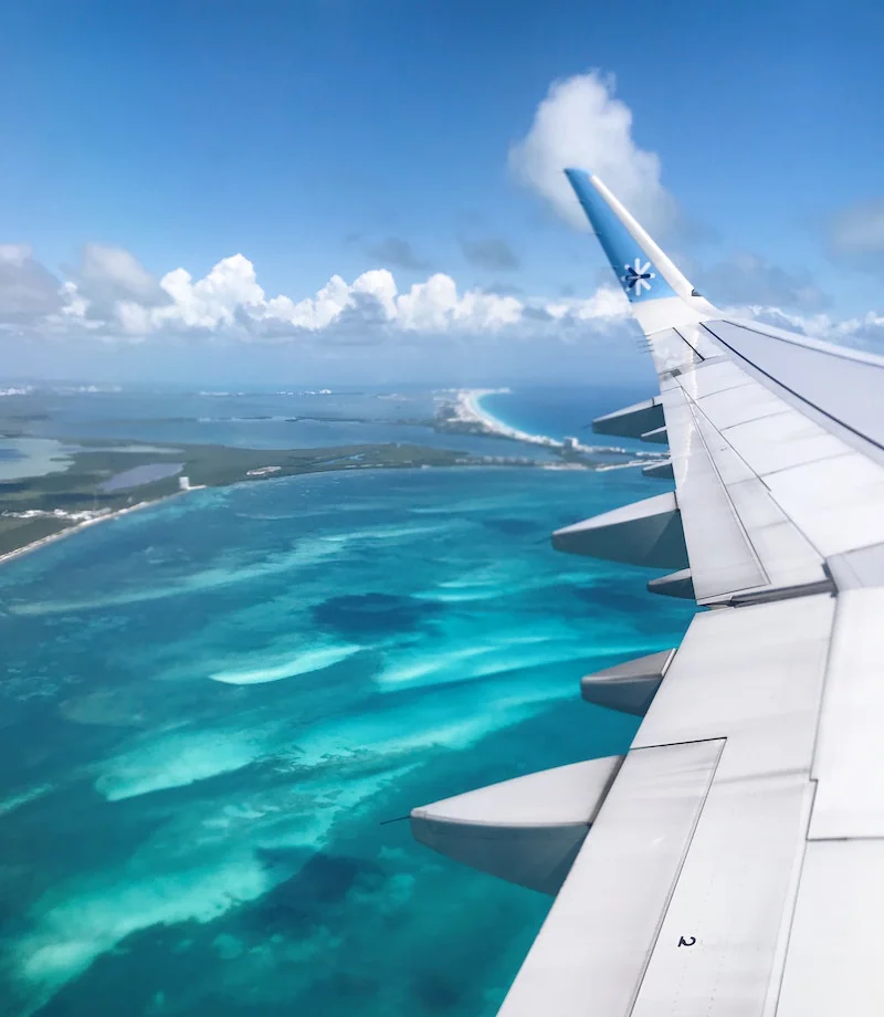 Plane over ocean aerial