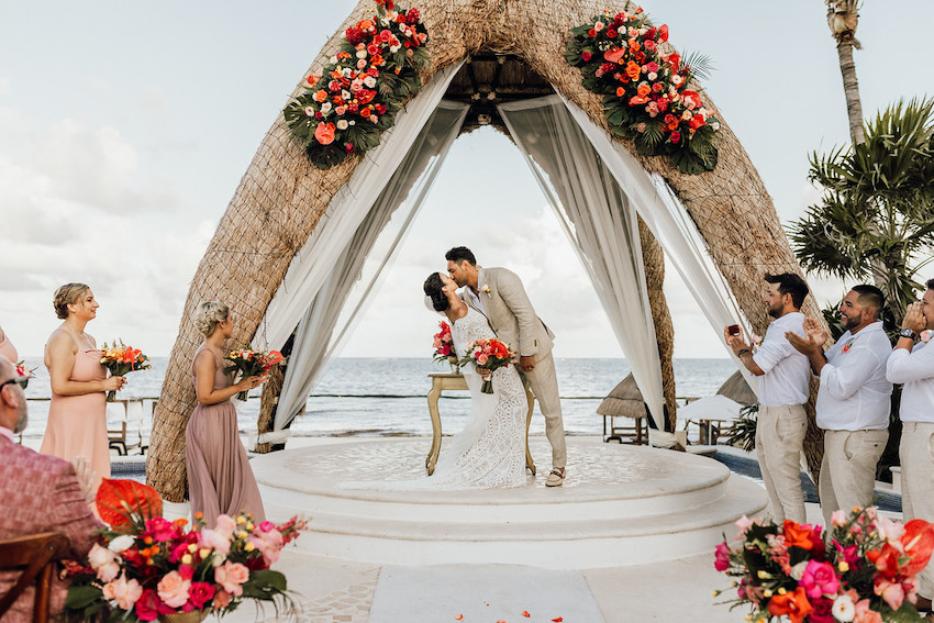 Couple kissing at resort wedding in Mexico