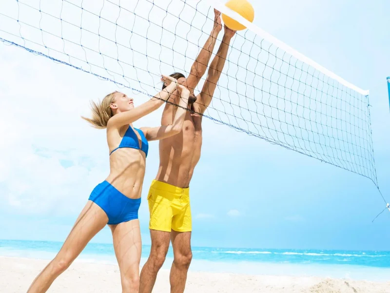 couple playing beach volleyball