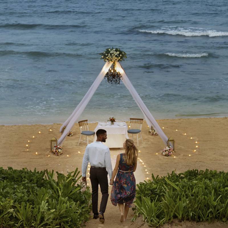 romantic dinner on beach couple