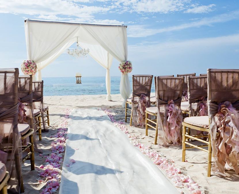 Wedding arch on the beach at El Dorado Casitas Royale