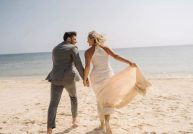 bride and groom on beach at El Dorado Royale