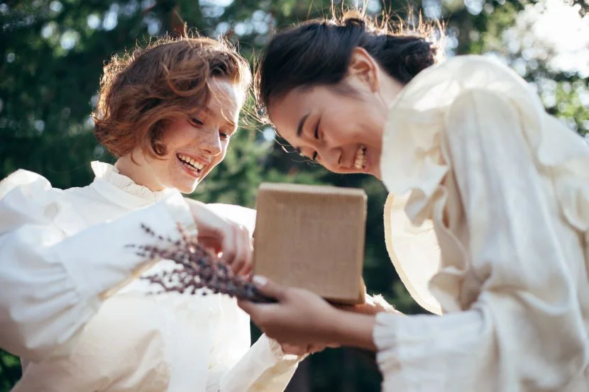 woman gifting the bride