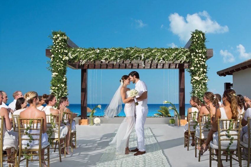 bride and groom at secrets playa mujeres