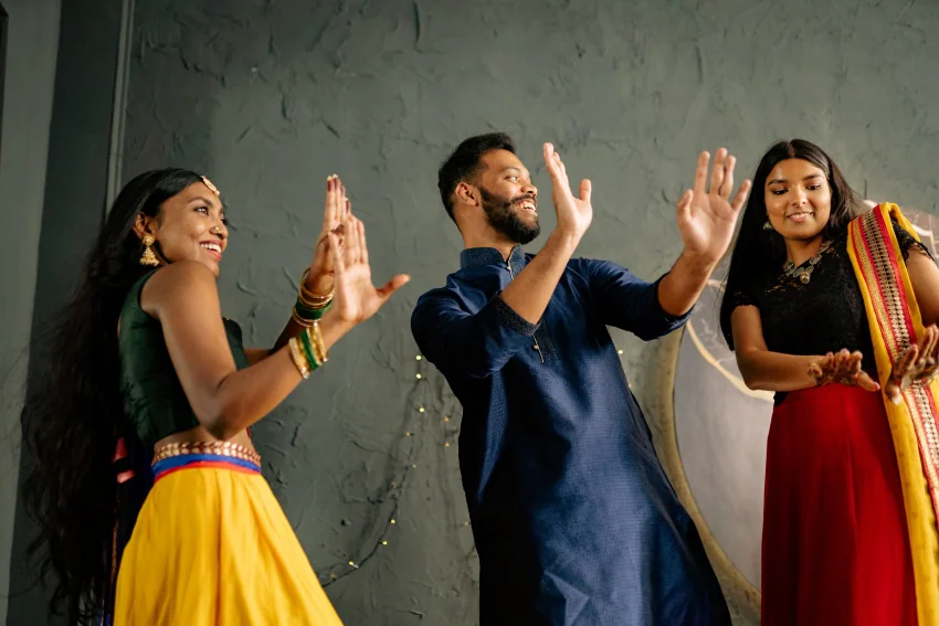 indians wearing traditional clothes dancing