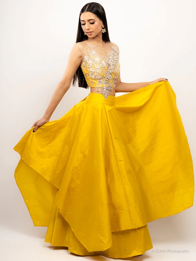 woman wearing yellow asymmetric hemline lehenga