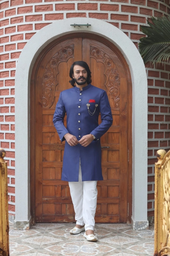 man wearing blue sherwani