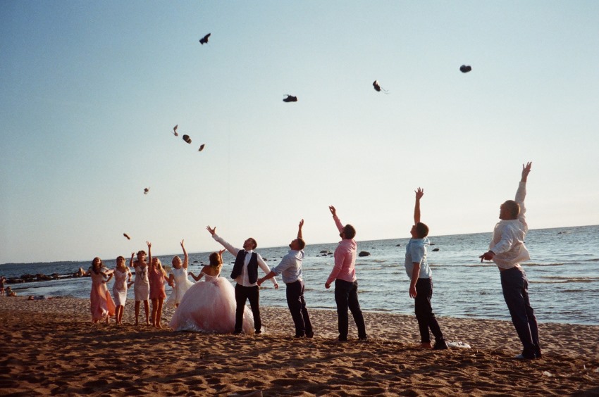 bride groom and wedding party on the beach