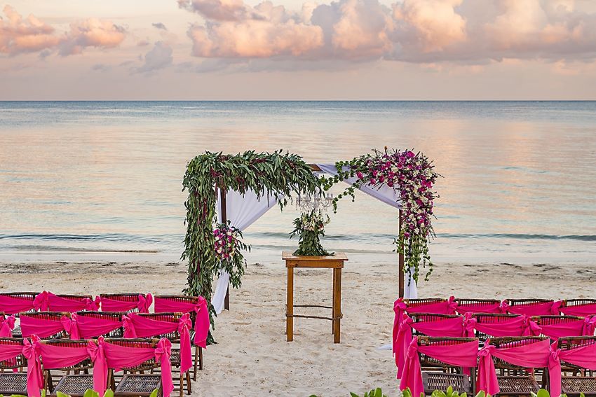 beach wedding setup at ocean coral and turquesa