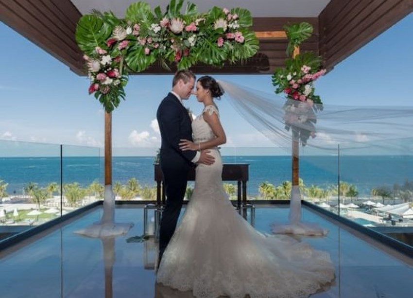 bride and groom at haven riviera cancun wedding altar