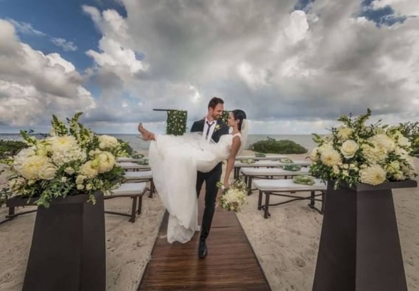 bride and groom on the beach at haven riviera cancun