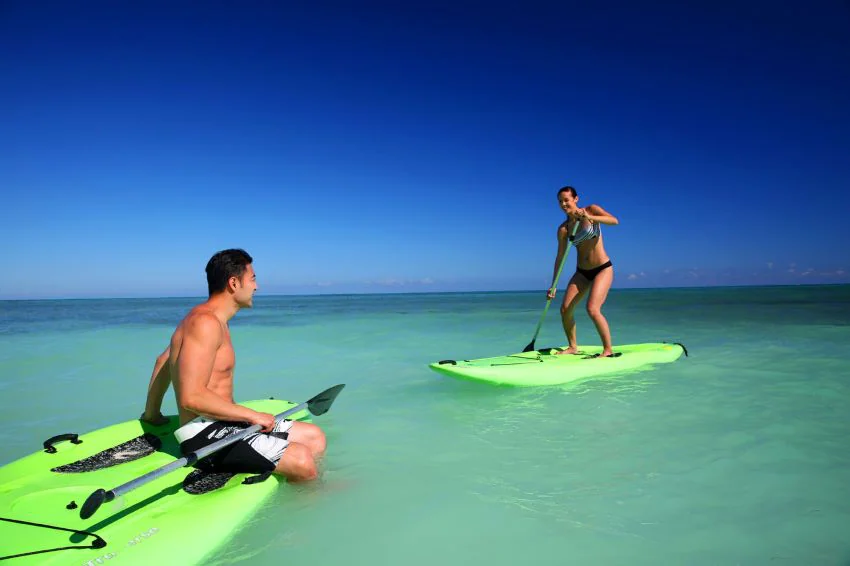 couple paddleboarding at hideaway at royalton negril