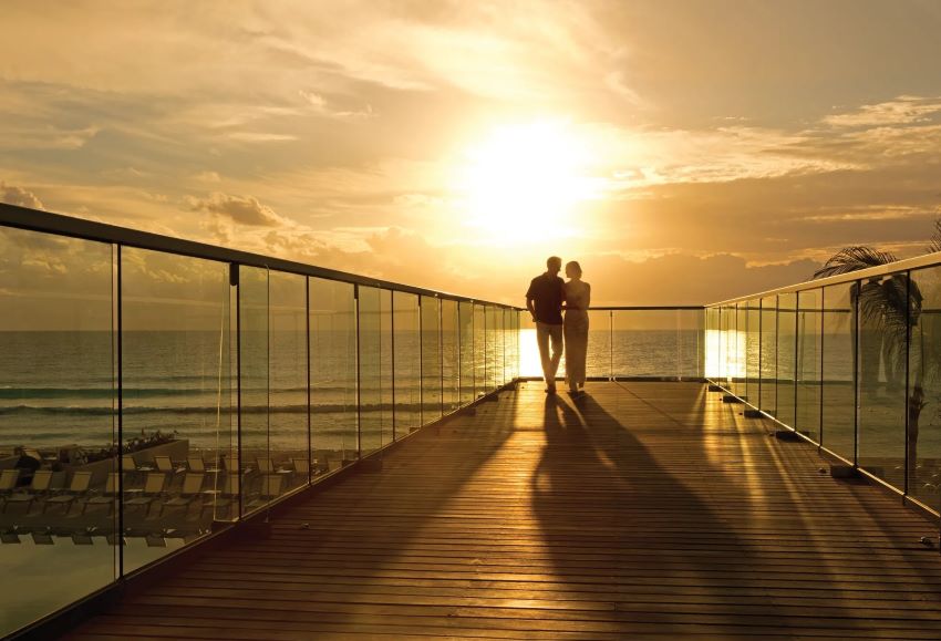 couple during sunset at secrets the vine cancun