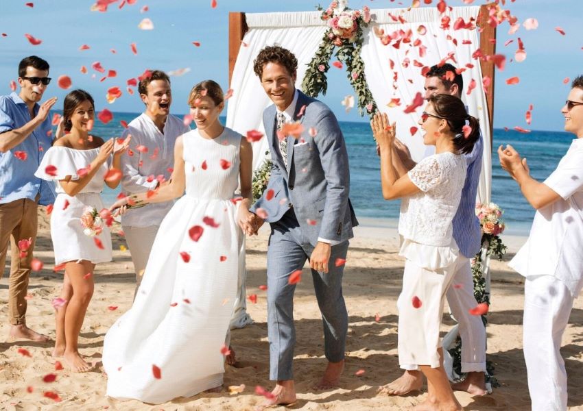 beach wedding setup with bride groom and guests