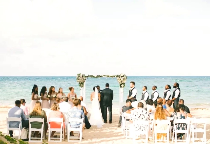 bride groom and guests at beach wedding excellence el carmen