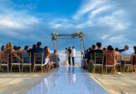 bride groom and guests at the beach venue at pueblo bonito rose