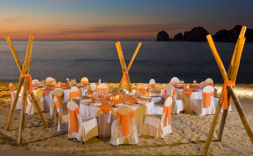 reception dinner setup on the beach at purblo bonito rose