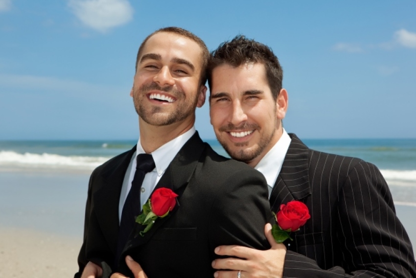 2 grooms at their beach wedding