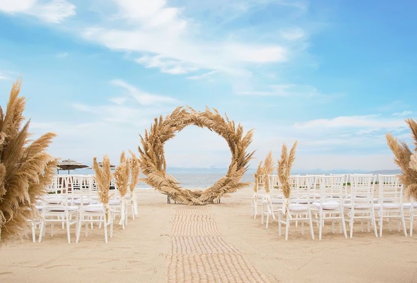 beach wedding setup at marival distinct luxury residences