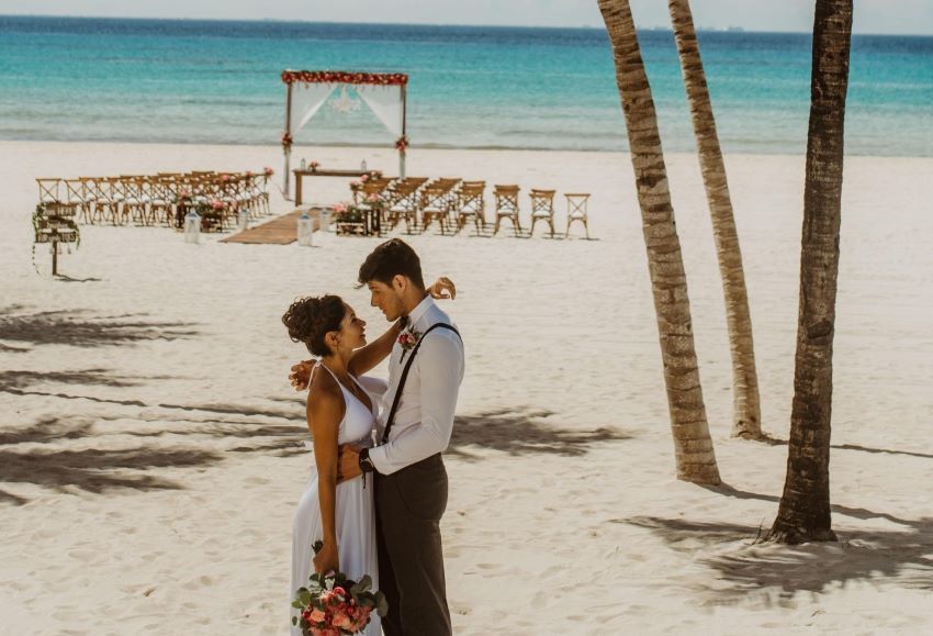 sandos playacar beach wedding venue with bride and groom