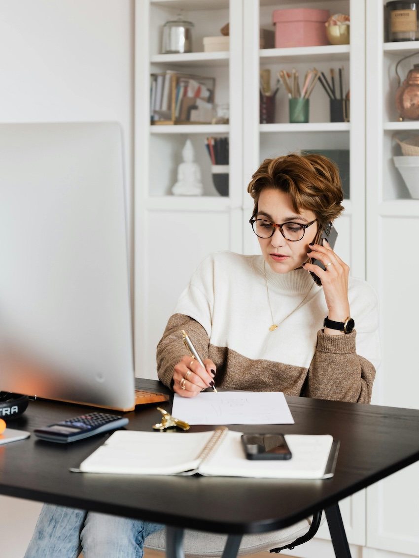 travel agent working at desk