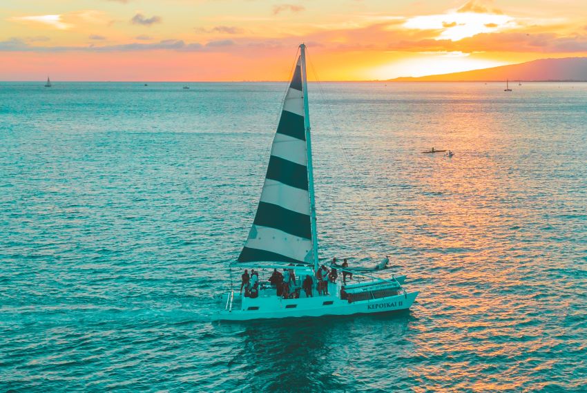 people on a sailboat on the sea