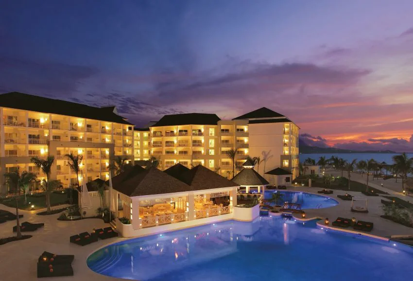 secret st james montego bay resort and pool at night