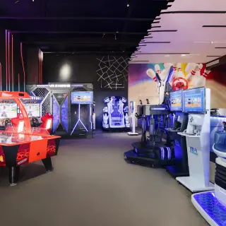 Air hockey table and video games in the arcade at Dreams Macao Beach, Punta Cana