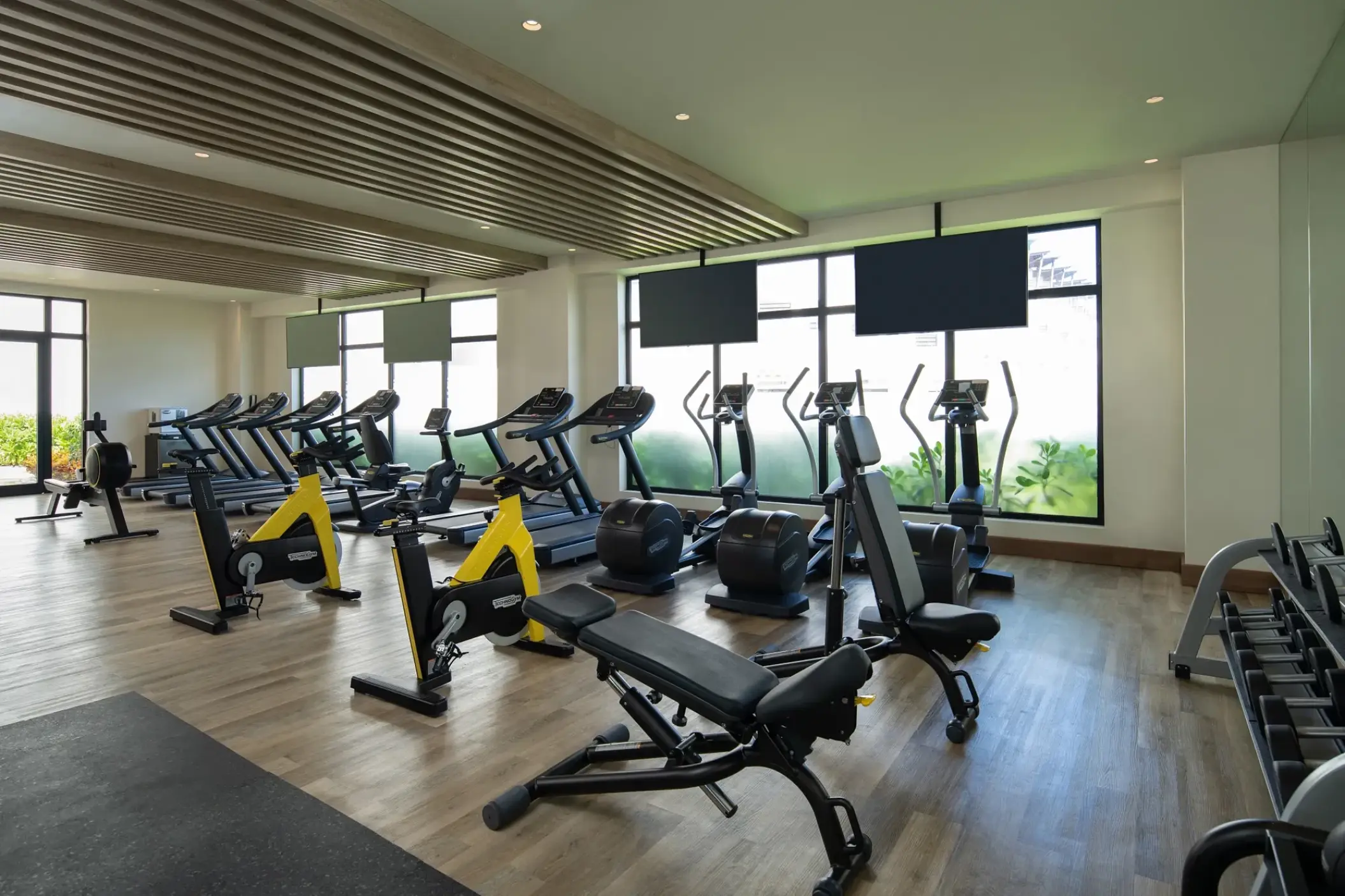 Fitness center with exercise bikes and treadmills at Dreams Macao Beach, Punta Cana