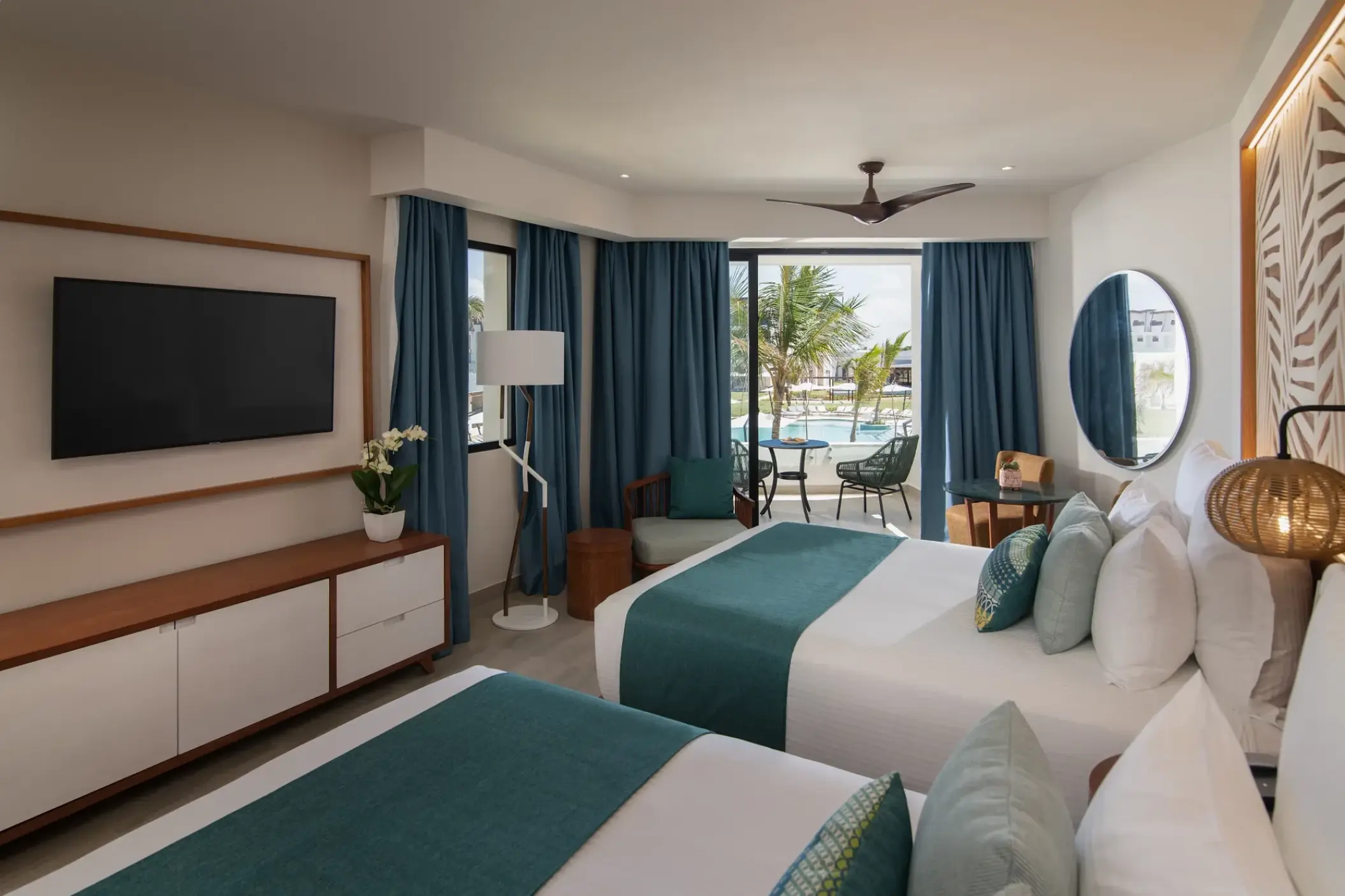Junior suite with two double beds and a private balcony at Dreams Macao Beach, Punta Cana