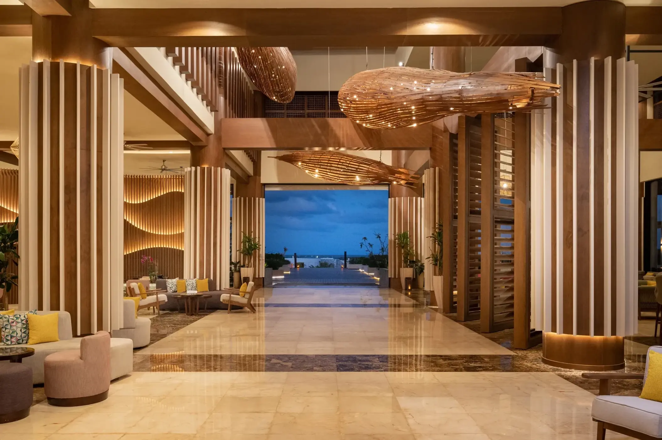 Open-air lobby with contemporary light fixtures at Dreams Macao Beach, Punta Cana