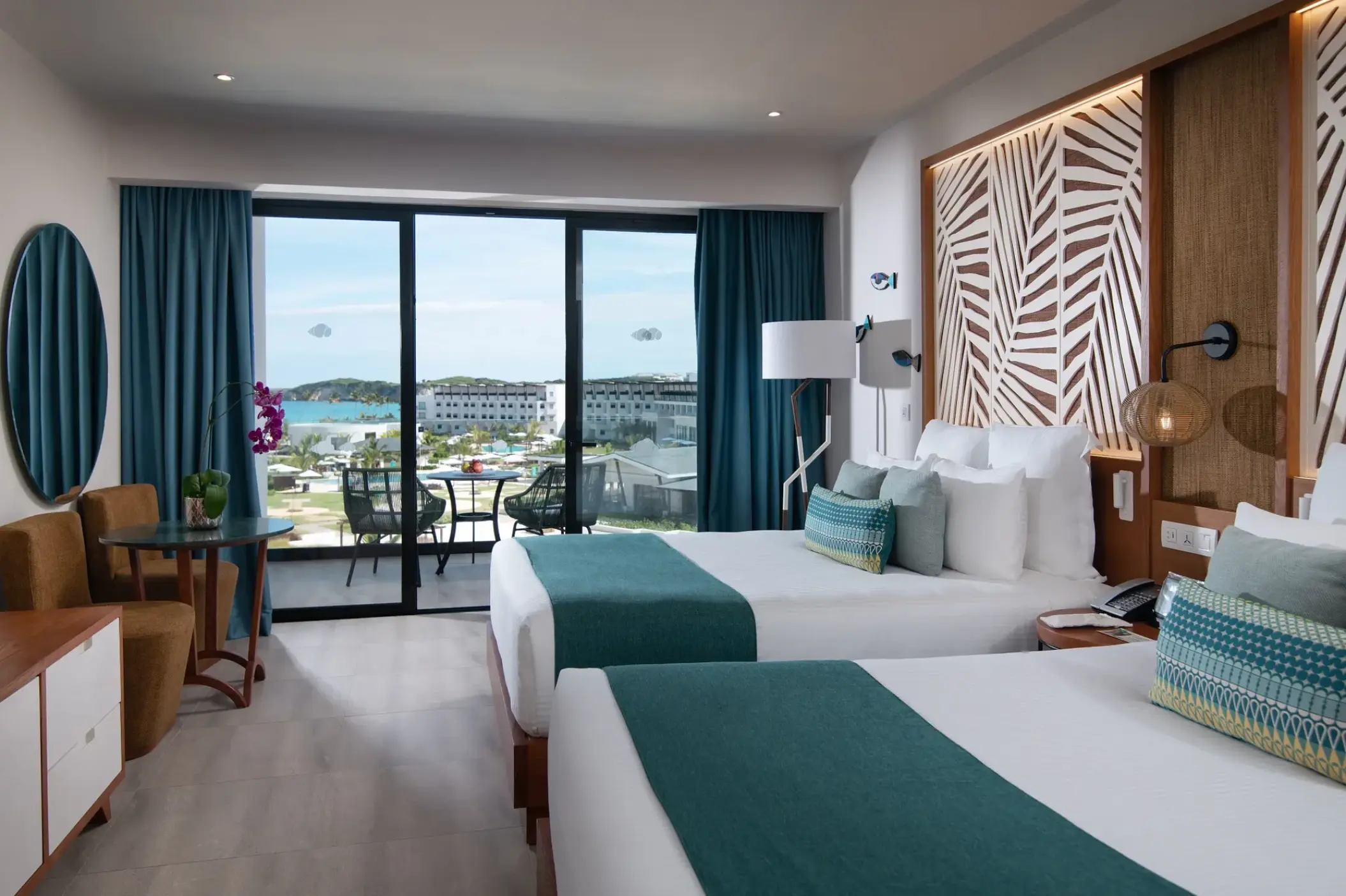 Junior suite with two double beds and a private balcony at Dreams Macao Beach, Punta Cana