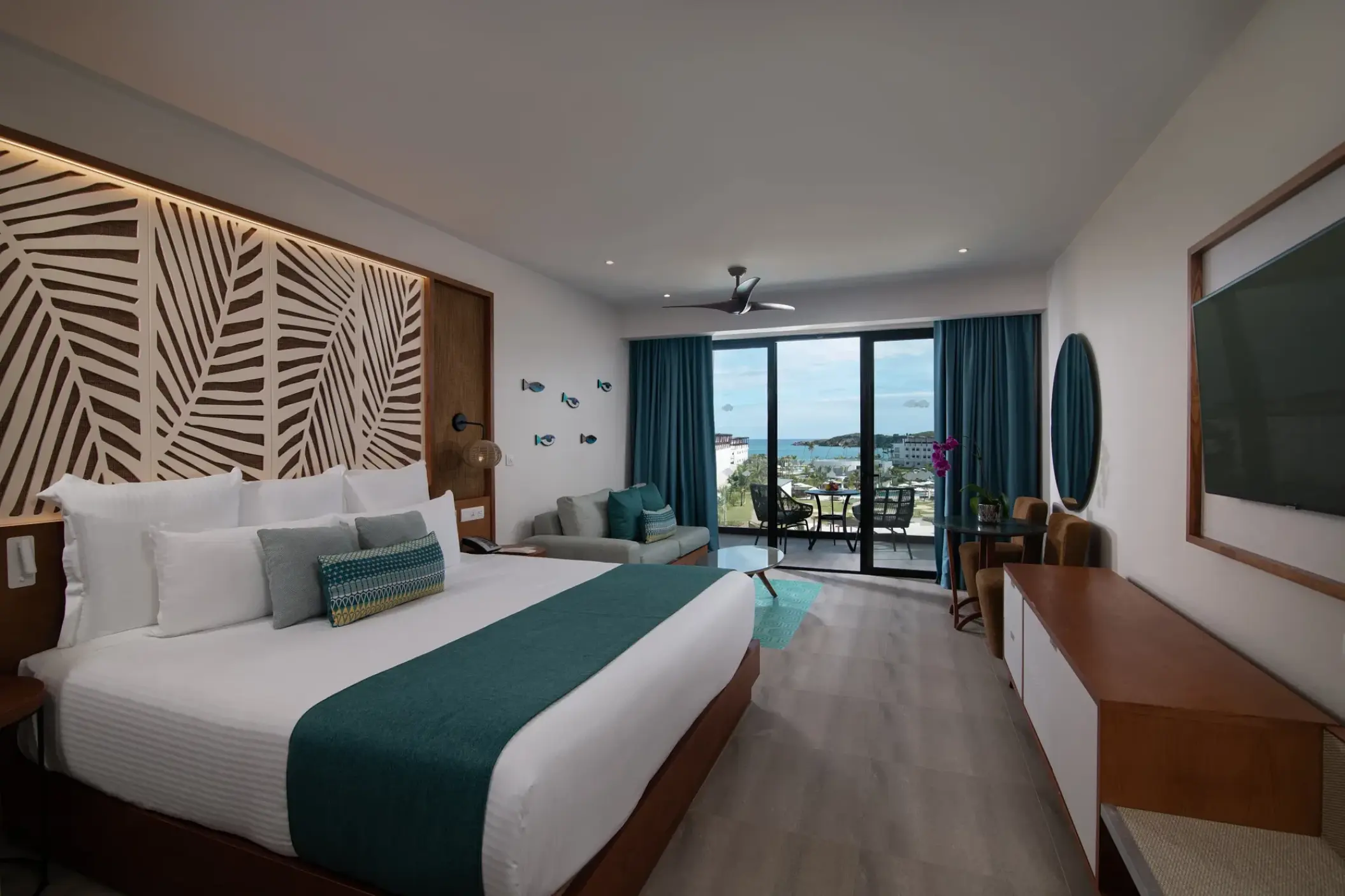 Junior suite guest room with king bed and ocean view balcony at Dreams Macao Beach, Punta Cana