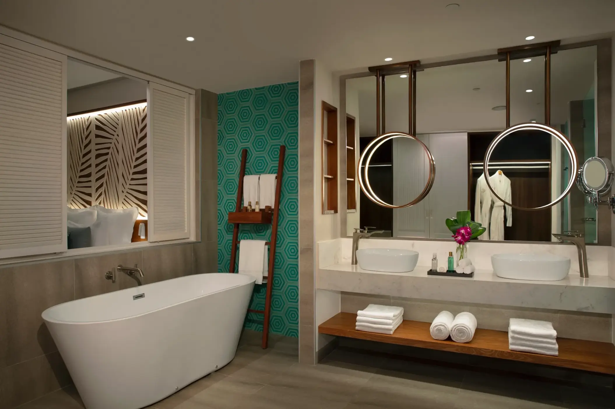 Master bathroom with soaking tub, double vanity, and hanging mirrors at Dreams Macao Beach, Punta Cana