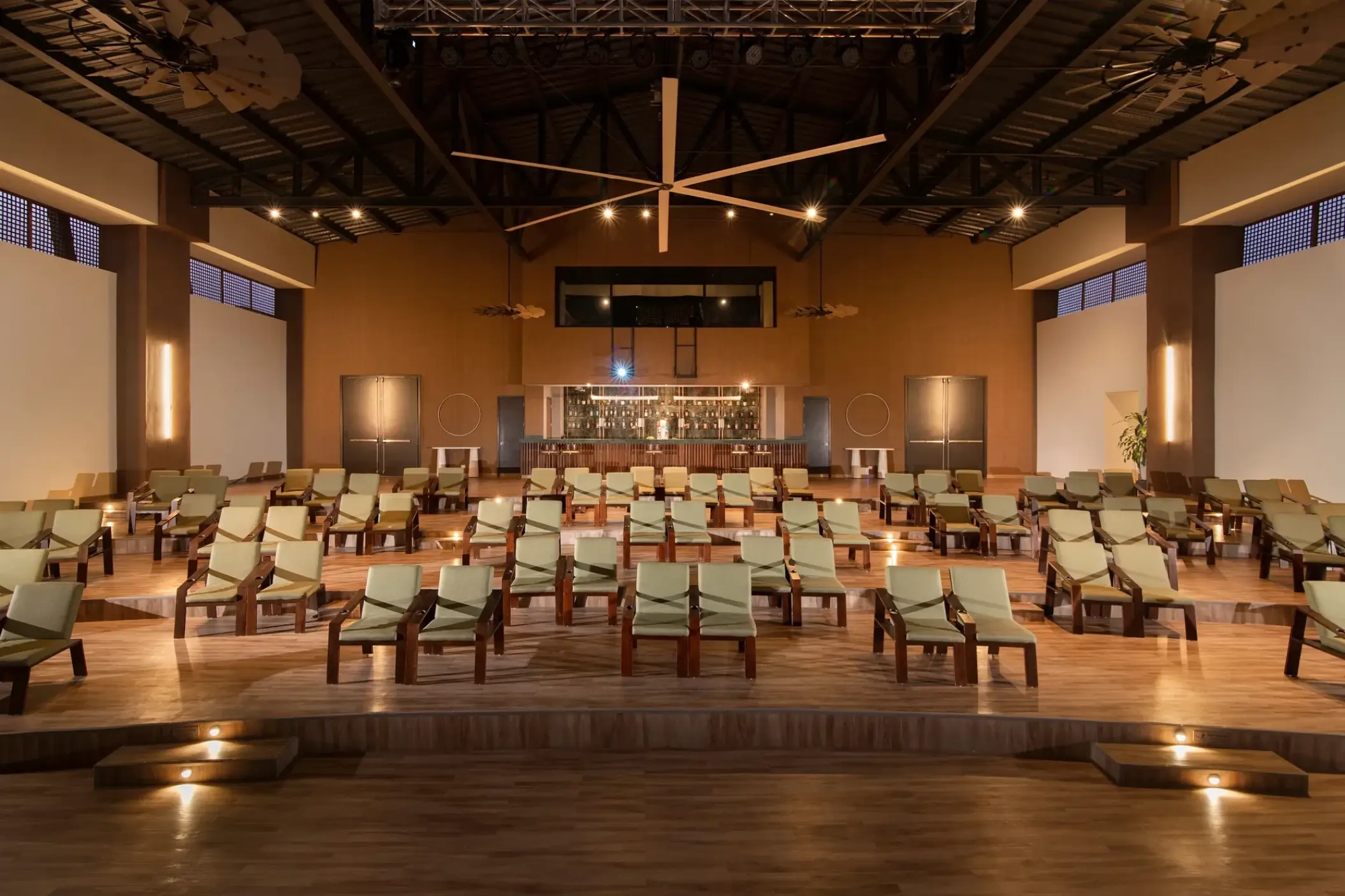 Indoor theater seating area and bar at Dreams Macao Beach, Punta Cana