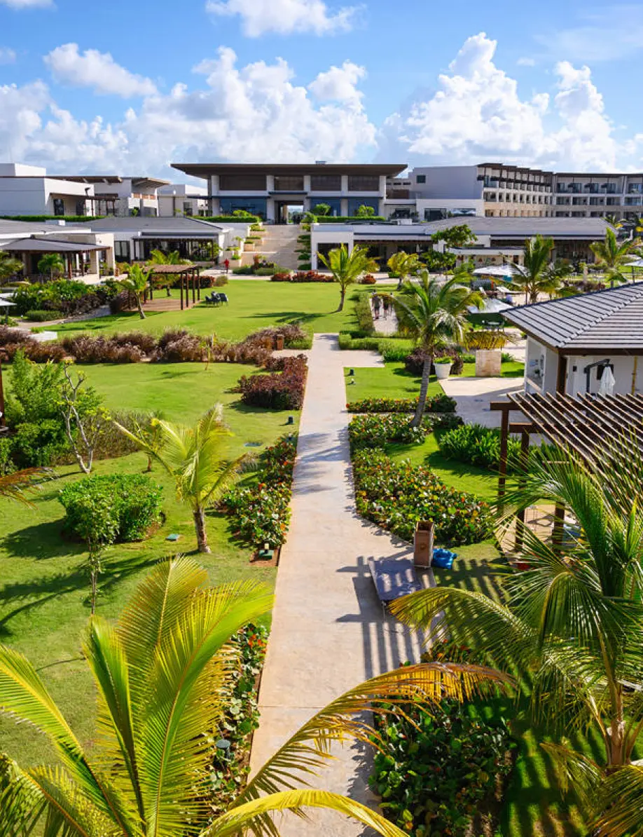 Lush tropical grounds and modern buildings at Dreams Macao, Punta Cana