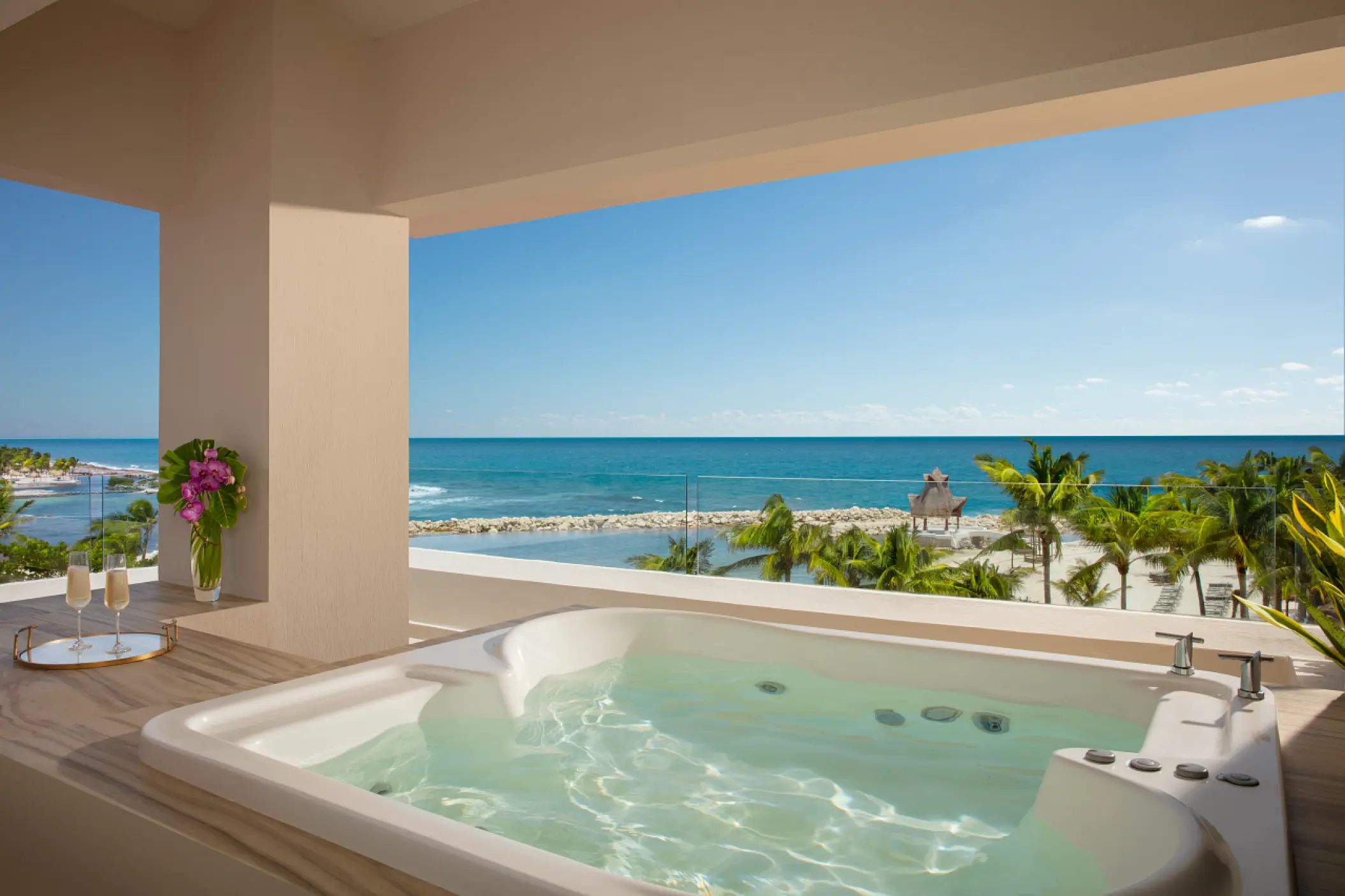 Private balcony hot tub with ocean views at Dreams Aventuras, Riviera Maya
