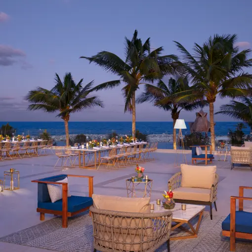 Rooftop wedding reception with lounge seating and ocean views at Dreams Aventuras, Riviera Maya