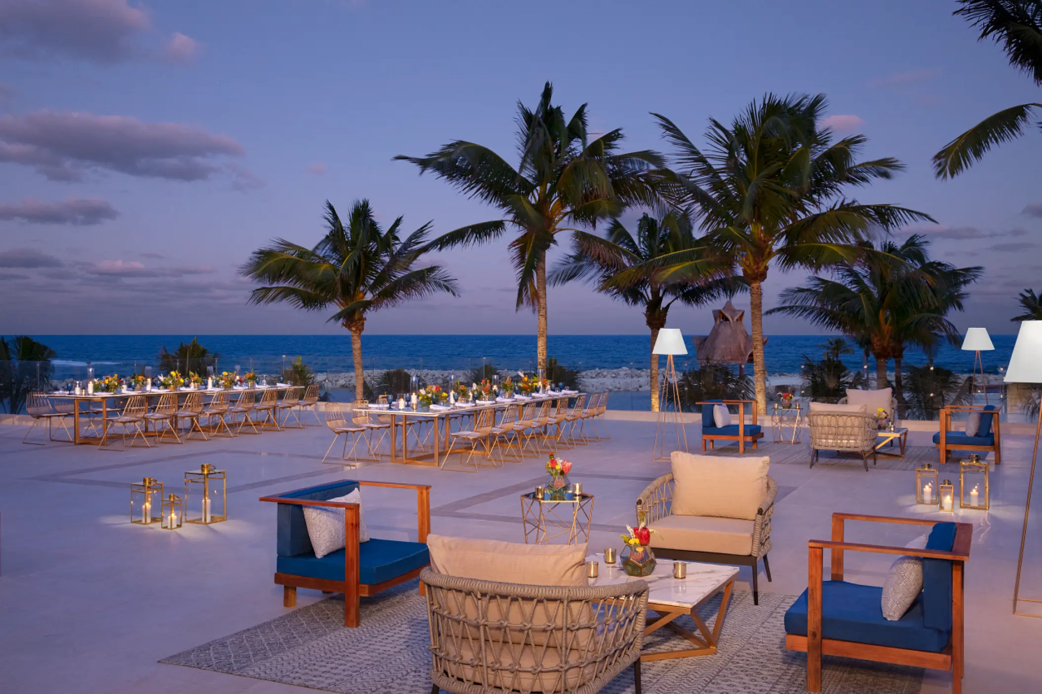 Rooftop wedding reception with lounge seating and ocean views at Dreams Aventuras, Riviera Maya