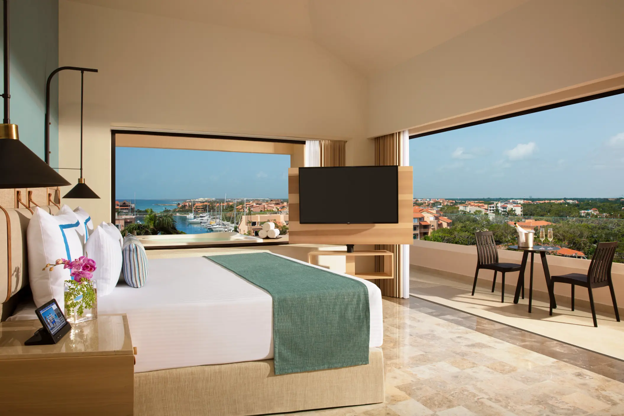 Guest suite with a balcony overlooking the marina at Dreams Aventuras, Riviera Maya