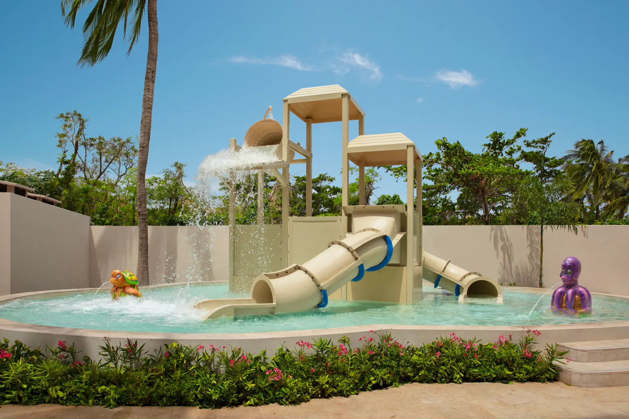 Outdoor kids water park with slides and splashing fountains at Dreams Aventuras, Riviera Maya