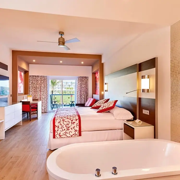 Modern suite with an integrated bathtub and balcony at Riu Palace Costa Mujeres, Cancun