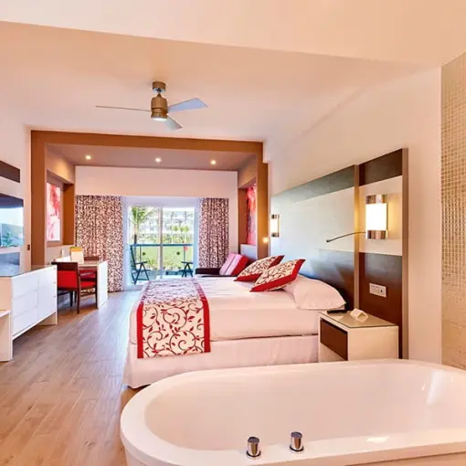 Modern suite with an integrated bathtub and balcony at Riu Palace Costa Mujeres, Cancun