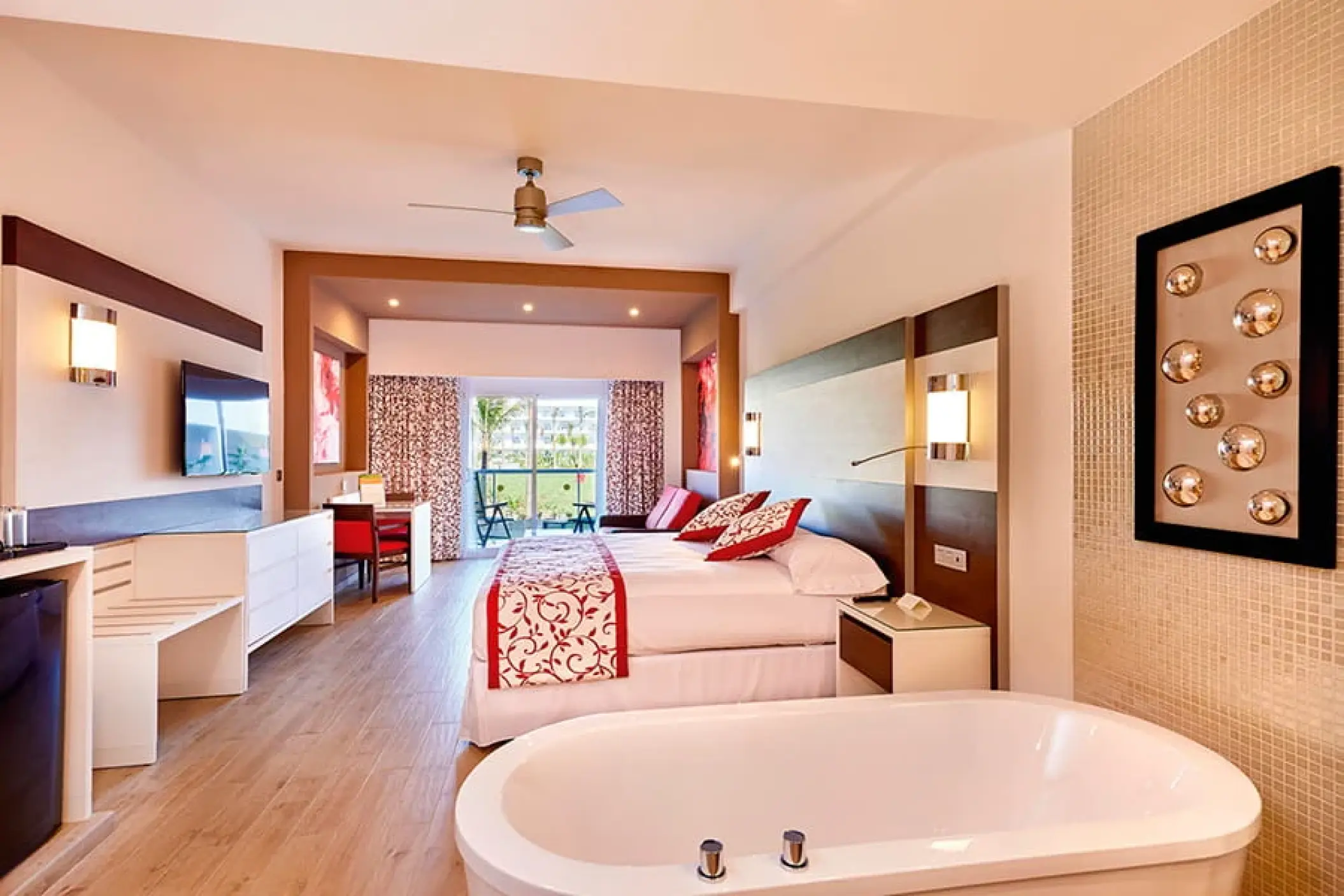 Modern suite with an integrated bathtub and balcony at Riu Palace Costa Mujeres, Cancun